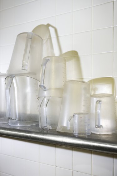 Clear measuring cups on shelf