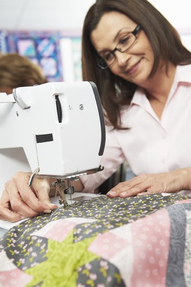 Woman Using Electric Sewing Machine