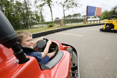 Boy riding go kart