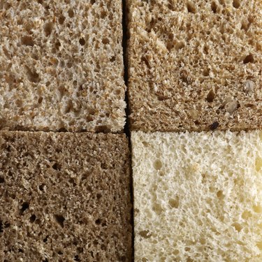 Four slices of bread of various colors and textures