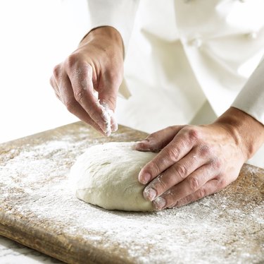 Chef rolling out dough