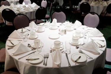 Tables with place settings in banquet room