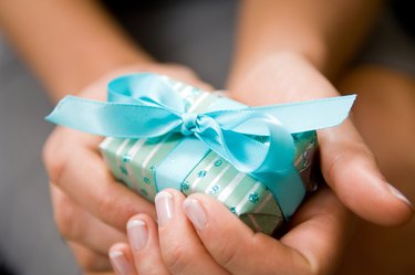 Hands holding Christmas present