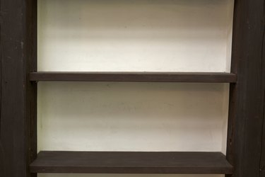 Close-up of empty wooden shelves