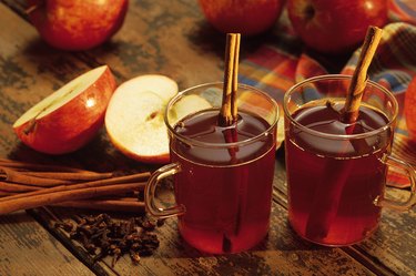 Hot spiced cider with cinnamon sticks