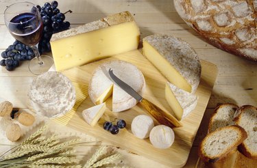 Cheeses on cutting board