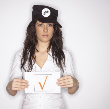 Woman advocating for voting holding sign