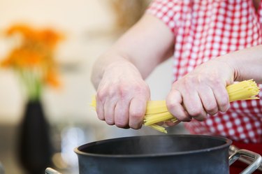 Woman cooking pasta