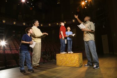 Teacher and students practicing a play