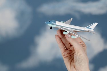 Woman holding toy airplane