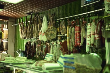 Cured meats hanging in deli
