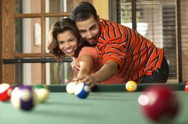 Couple playing pool