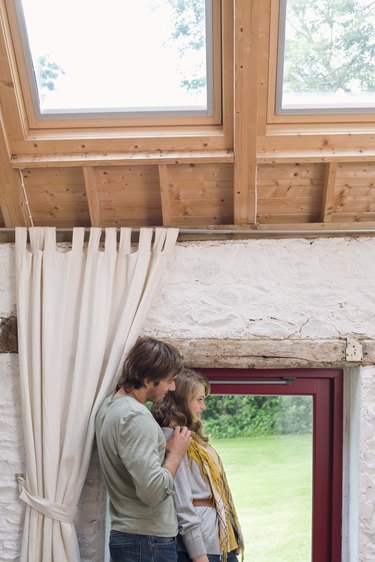 Couple looking through window