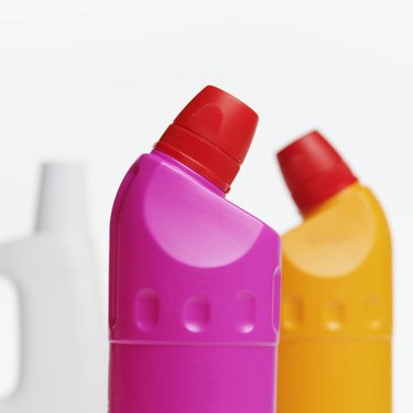 Close-up view of three cleaning product bottles