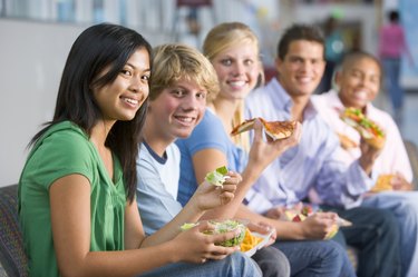 Teenagers enjoying lunch together