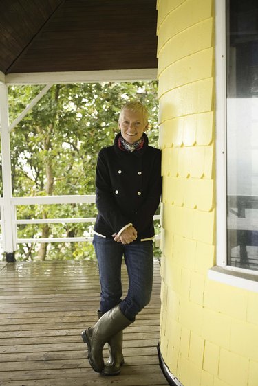 Woman standing on veranda