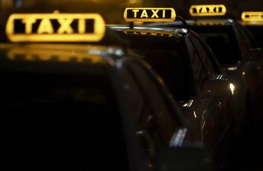 Row of illuminated taxis