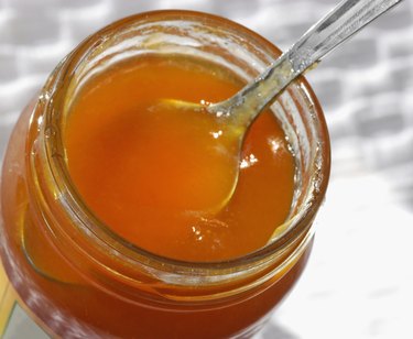 Close-up of spoon in a jar of jam