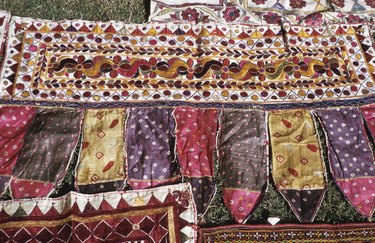 Colorful quilted fabrics on lawn in India