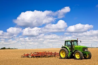 Tractor in plowed field