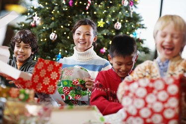 Children Unwrapping Christmas Gifts