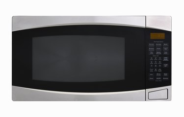 Stainless steel microwave oven on white