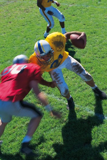 Runner meets tackler in football game