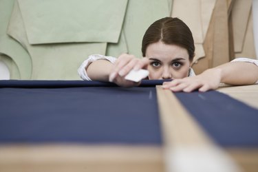 Woman measuring fabric