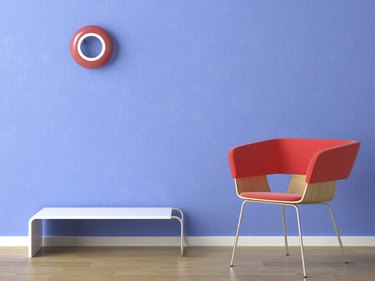 red chair on blue wall