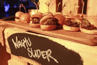 Hamburger slider on a rustic cutting wooden board.