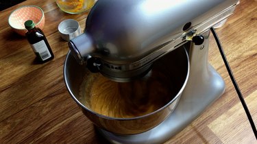 Mixing pumpkin pie filling in a stand mixer.