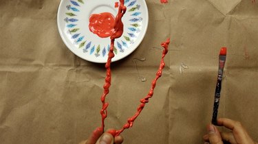 Painting DIY faux coral sculpture.