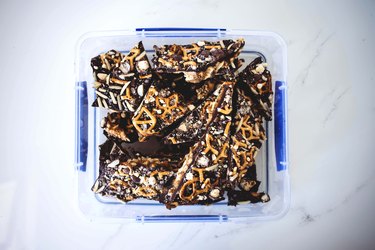 Chocolate bark placed in an air-tight container.