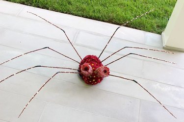 Use autumn's bright flowers to make a not-so-scary spider centerpiece.