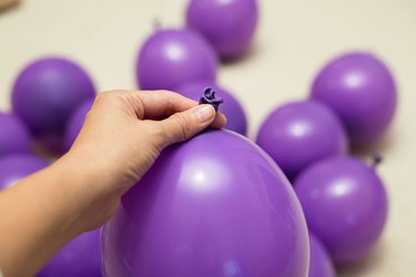 Blow up purple balloons