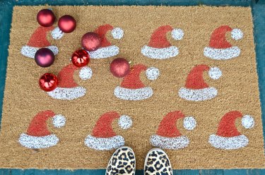 DIY red and white stenciled santa hat welcome mat