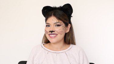 Finished cat makeup look with leopard spots and cat ears