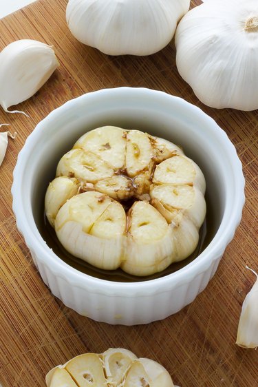 head of garlic in ramekin