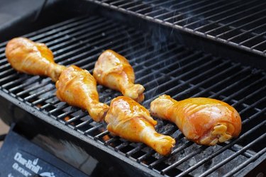 Chicken drumsticks on a grill