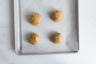 Place the evenly sized cookie dough balls onto the baking trays.