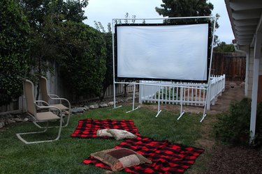 finished movie screen set up outside with chairs and blankets