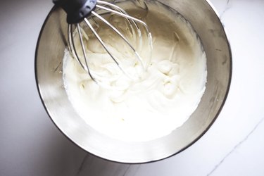 Whisk the cream to form soft, fluffy peaks.