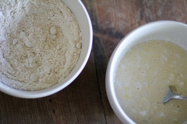 Two bowls of mixed muffin ingredients.