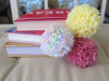 A top view of the pompom bookmarks.