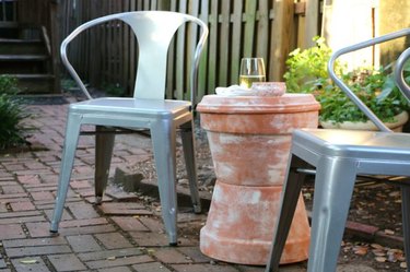 Outdoor accent table made out of terra cotta pots.