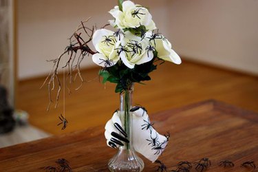 A creepy floral arrangement is a great centerpiece for your frightful Halloween feast.