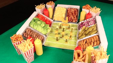 filling in the sides of the stadium with french fries, onion rings and condiment bottles