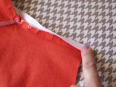 Fold the bias tape over the seam allowance.