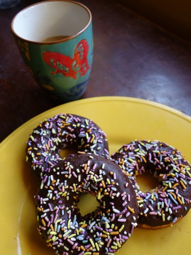 Healthy coconut flour low carb chocolate covered donut with sprinkles.