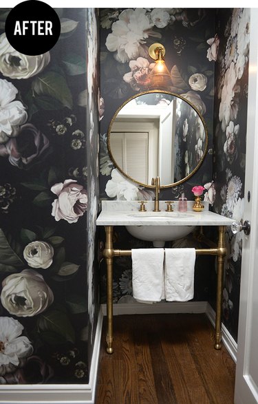 Powder room with bold floral wallpaper